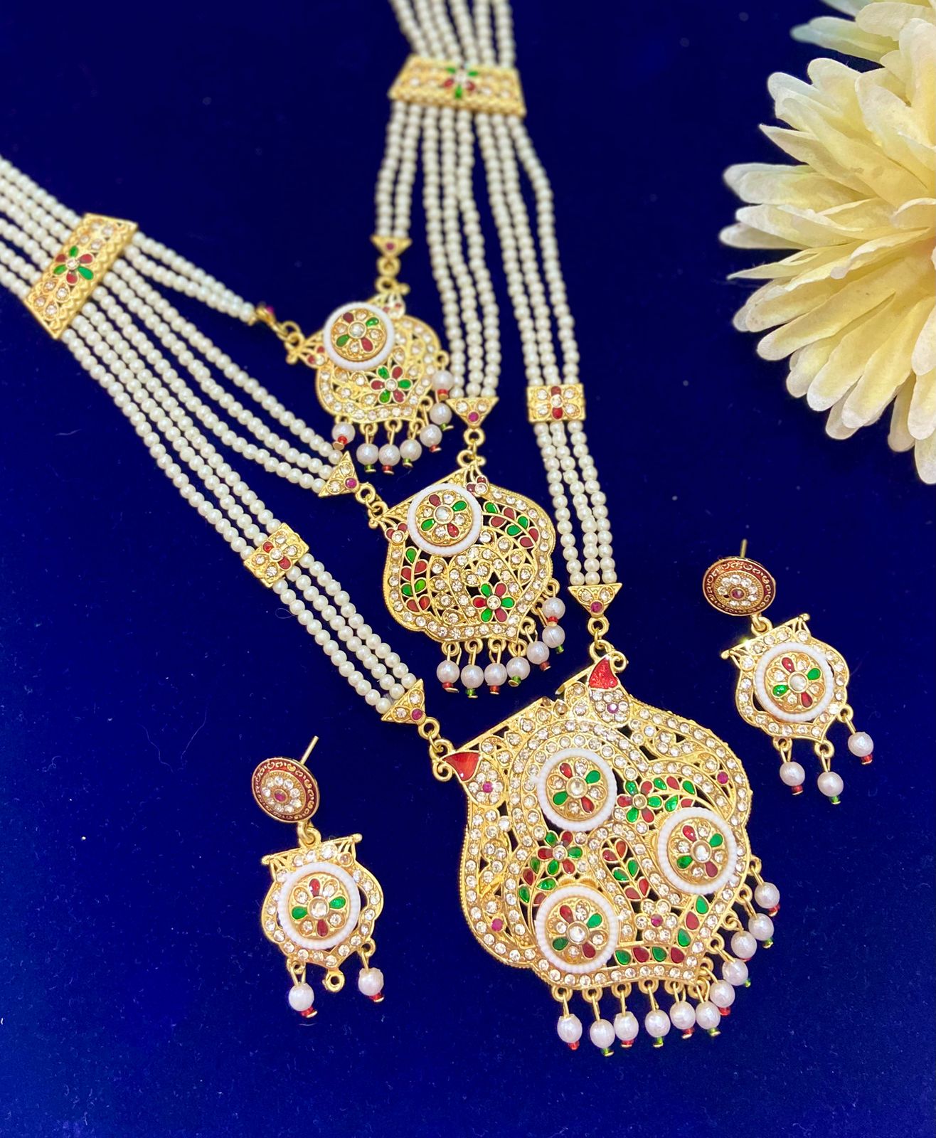 Three layered necklace set with earrings.