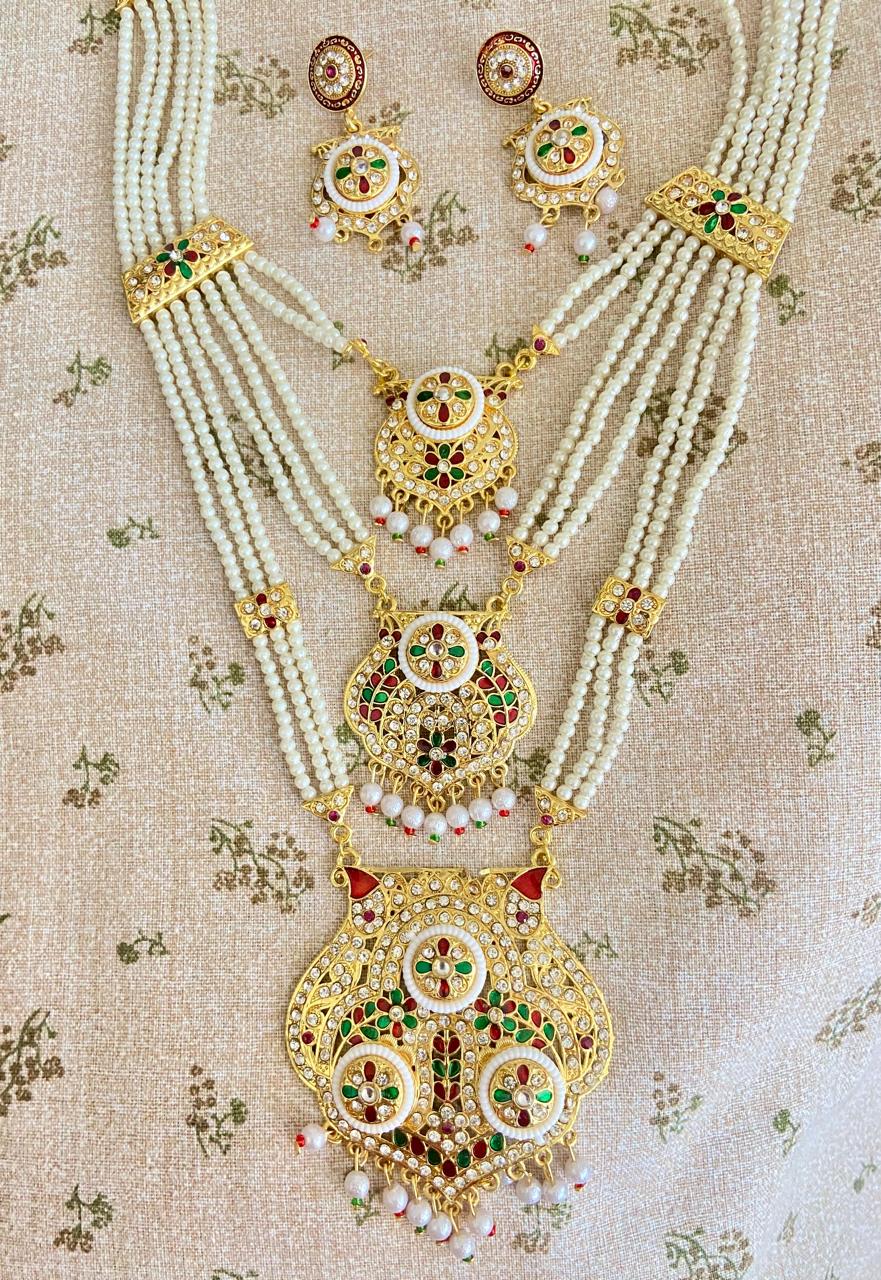 Three layered necklace set with earrings.